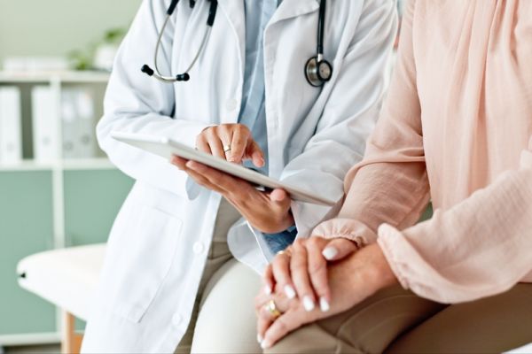 Doctor Showing Laboratory Results to Patient - United Personal Injury Care